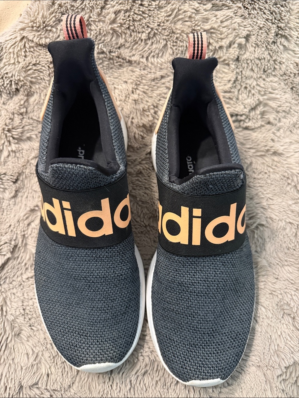 adidas women’s Slip-On Knit Sneakers in Charcoal with Peach Logo